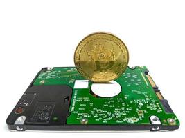 Computer hard drive and bitcoin crypto isolated on white background photo