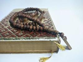 Islamic concept - The Holy Al Quran, on white background, with copy space photo