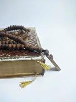 Islamic concept - The Holy Al Quran, on white background, with copy space photo