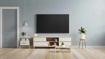 Smart TV on the blue color wall in living room,minimal design. 3D illustration rendering