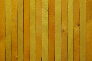 The bright yellow wooden background. Colorful background. photo