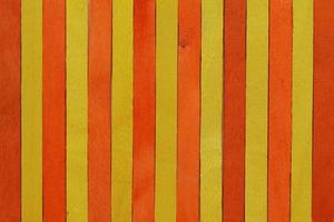 The bright yellow and orange wooden background. photo