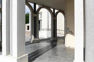 Tresigallo,Italy-may 2, 2021-detail of the porch in Tresigallo during a cloudy day photo