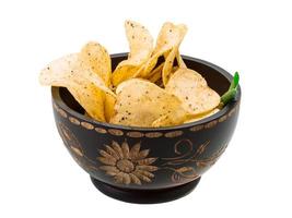 Potato chips in a bowl on white background photo