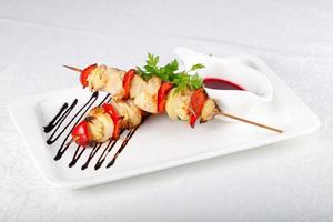 Chicken skewer dish view photo