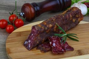 Salami sausage on wood photo