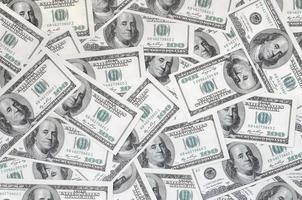 A pattern of many dollar bills. Background image photo