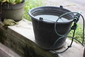 the bucket is given a rope to draw water photo