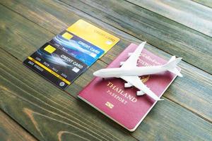 Passport with  credit card on wooden desk photo