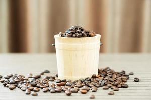 Coffee beans in wood bucket photo