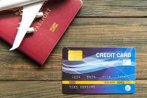 Credit card put on wooden desk with passport photo