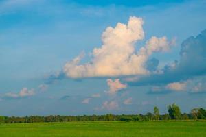 The sky and clouds of the green fields. photo