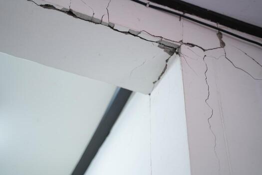 Houses that are not built to the standard, broken beams, cracked walls and house subsidence. photo