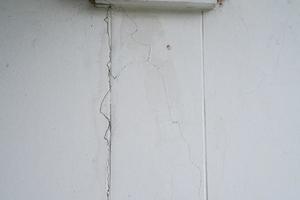 Houses that are not built to the standard, broken beams, cracked walls and house subsidence. photo