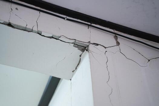 Houses that are not built to the standard, broken beams, cracked walls and house subsidence. photo