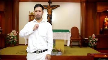 Asian man beard wearing whith shirt christian video