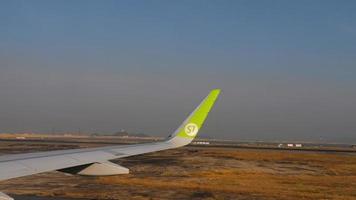 HONG KONG NOVEMBER 7, 2019 - View from descending S7 Airlines Airbus 320 airliner on final approach to Chek Lap Kok airport video