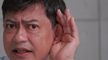 Asian senior man couldn't hear the cause of his deafness. video