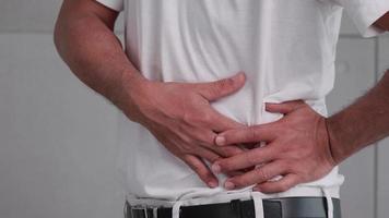 Asian man has severe stomach pains caused by appendicitis. video