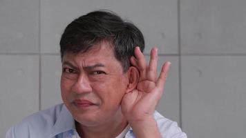 Asian senior man couldn't hear the cause of his deafness. video