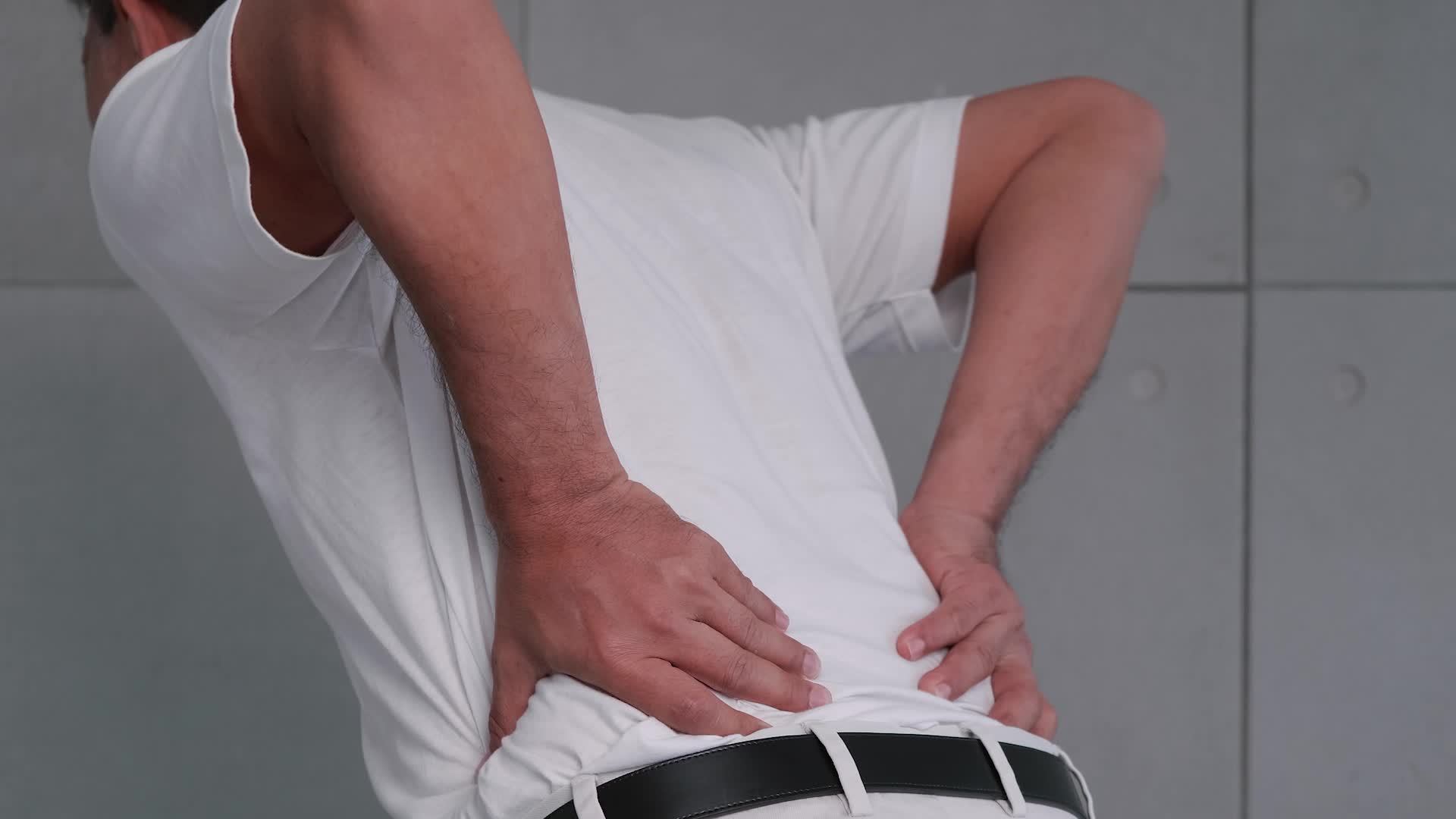 Asian old man back pain after lifting heavy object. 12900892 Stock