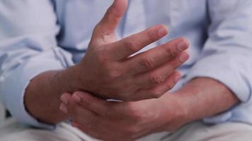 An elderly man's hand is trembling because of Parkinson's disease. video