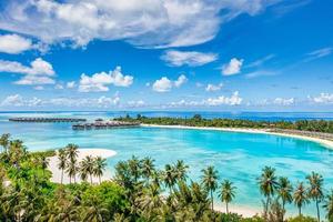 Sea beach aerial. Luxury summer travel vacation landscape. Tropical beach, drone view. Beach villas bungalows of hotel resort. Perfect beach scene vacation, summer holiday template. Wonderful nature photo