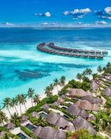 Amazing island beach. Maldives from aerial view tranquil tropical landscape seaside with palm trees on white sandy beach. Exotic nature shore, luxury resort island. Beautiful summer holiday tourism photo