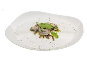 Herring fillet on the plate and white background photo