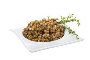 Baked lentil on white photo