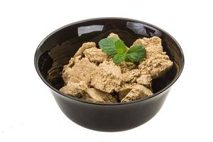 Sunflower Halva in a bowl on white background photo