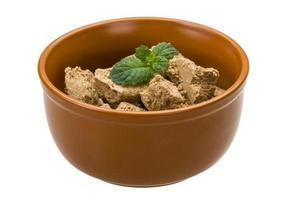 Sunflower Halva in a bowl on white background photo