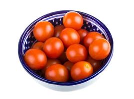 Cherry tomatoes on white photo