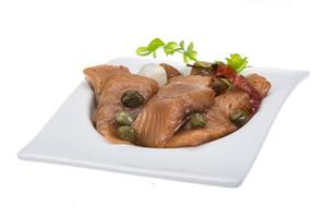 Sliced herring on white photo