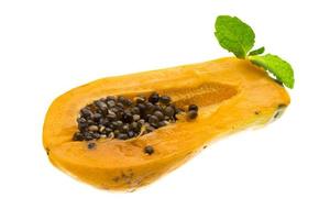 Ripe papaya on white background photo