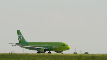 KAZAN, RUSSIA AUGUST 05, 2022 - Passenger plane of S7 airlines on the runway of Kazan airport. Jet plane on the airfield on a summer day. Tourism and travel concept video