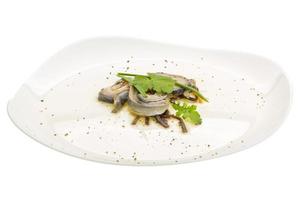 Herring fillet on the plate and white background photo