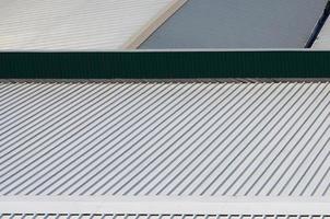 Metal gray roof with rhythmic parallel relief directions photo