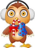 Cute Cartoon owl in a headphone with candy and scarf vector