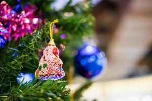Decorated Christmas baubles on fir tree New Year holidays background photo