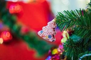 Decorated Christmas baubles on fir tree New Year holidays background photo