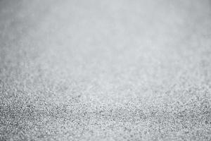 Abstract silver glitter sparkle texture with bokeh background photo