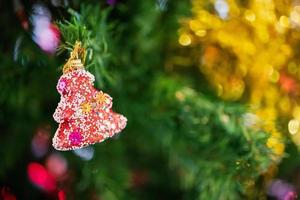Decorated Christmas baubles on fir tree New Year holidays background photo