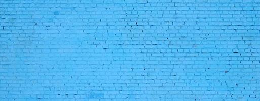 Square brick block wall background and texture. Painted in blue photo