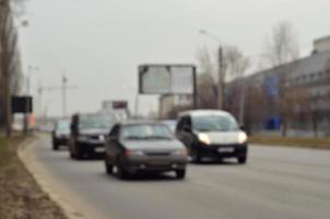 Blurred landscape with a city road during traffic photo