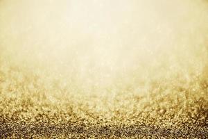 Abstract gold glitter sparkle blurred with bokeh background photo