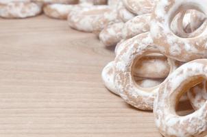Glazed bagels on wooden table photo