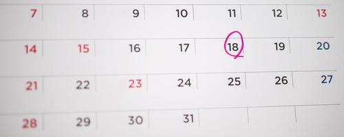 Red circle mark at 18th on calendar date business planning appointment meeting concept photo