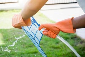 Asian man cleaning air conditioner dirty filter photo