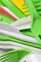 Pile of bright yellow, green and white used plastic kitchenware appliances photo